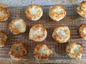 cheesy bread cooling on rack